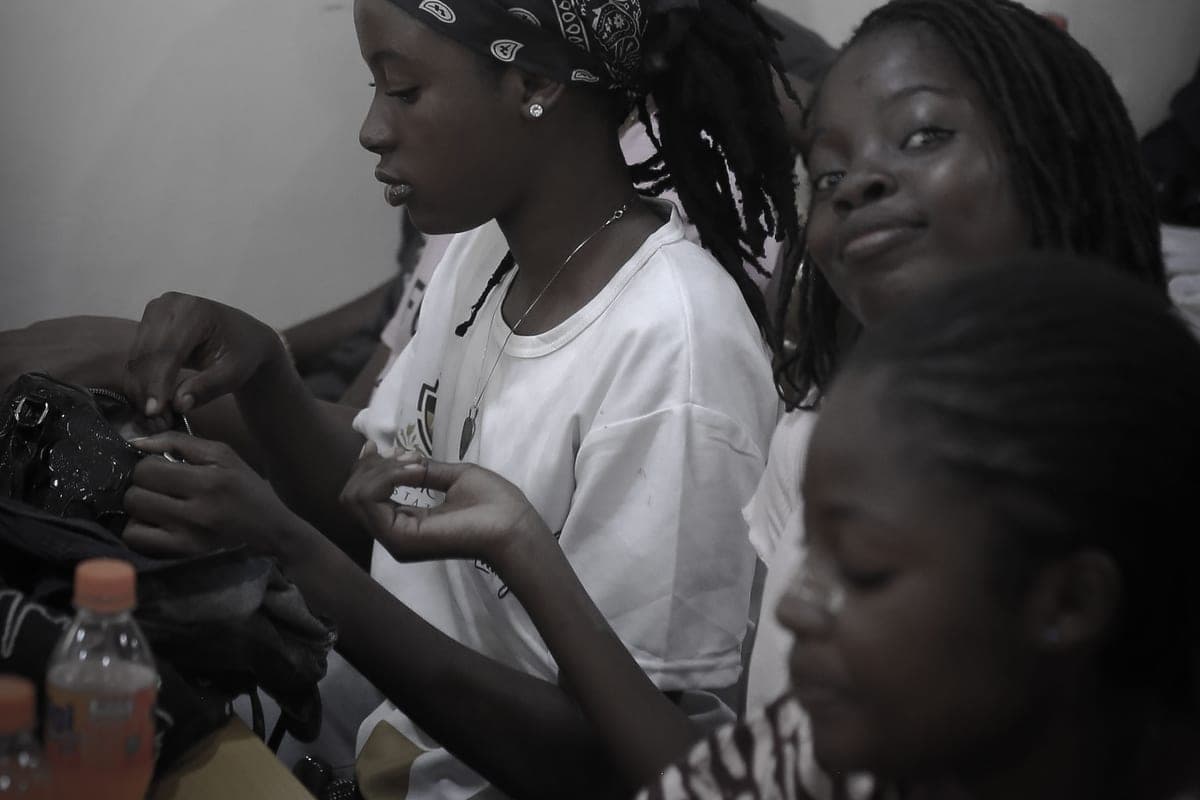 Two teenage girls in a quiet moment together during a Sunflower Foundation session